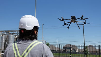 Drone hovering near pilot