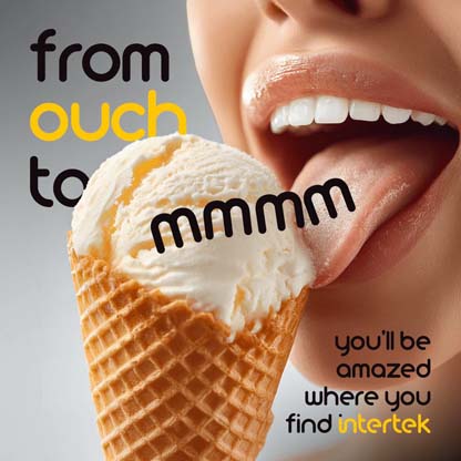 A woman licking the ice cream served in a waffle cone