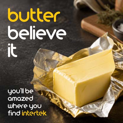A stick of unwrapped butter on a table