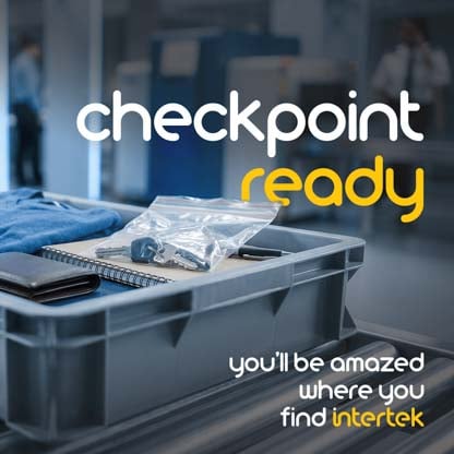 A filled airport baggage inspection tray